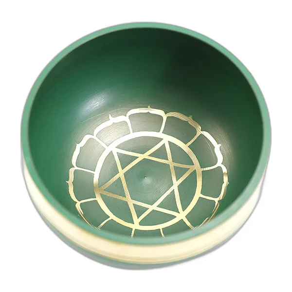 Small green singing bowl seen from above, engraved gold motif inside