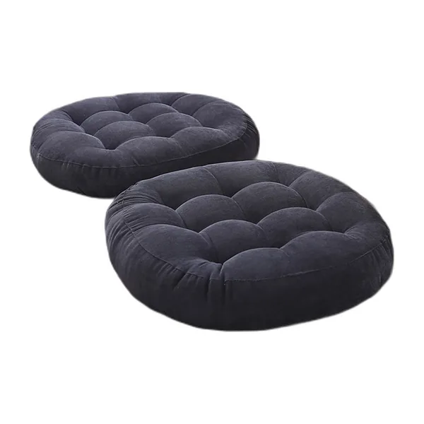 Round tufted floor cushion in charcoal corduroy
