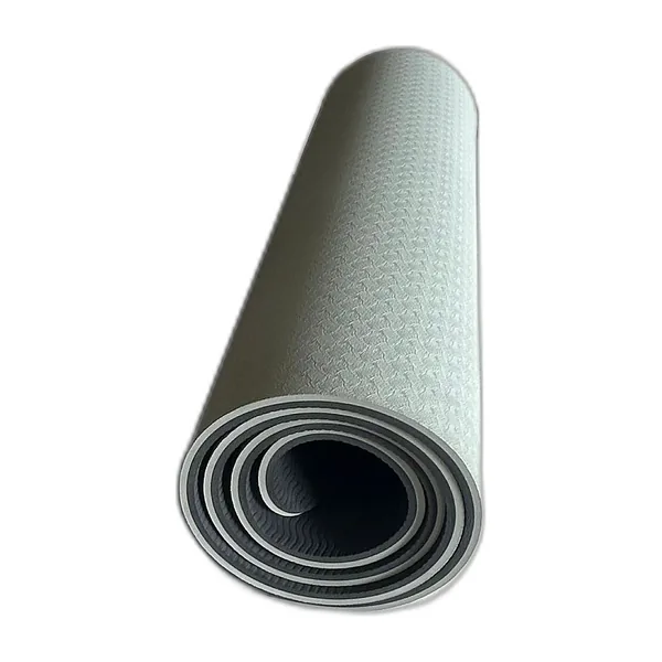 Grey and black TPE yoga mat rolled up, textured side visible