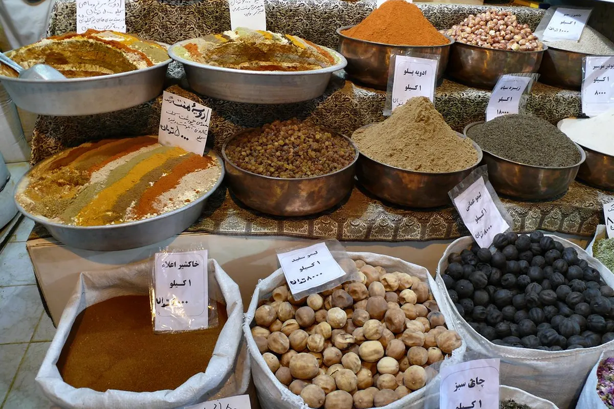 Loose spices on market stalls: turmeric, pepper, chillies and seeds